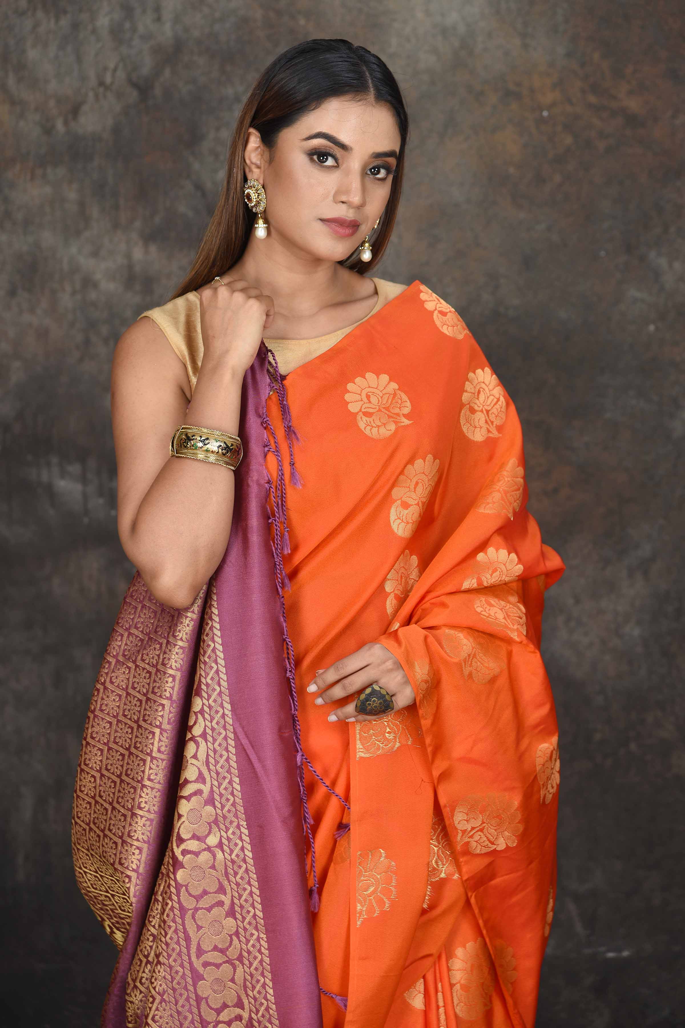 Buy stunning orange Kanjivaram soft silk sari online in USA with purple zari border. Be the center of attraction on special occasions in ethnic sarees, designer sarees, embroidered sarees, handwoven sarees, pure silk sarees from Pure Elegance Indian saree store in USA.-closeup