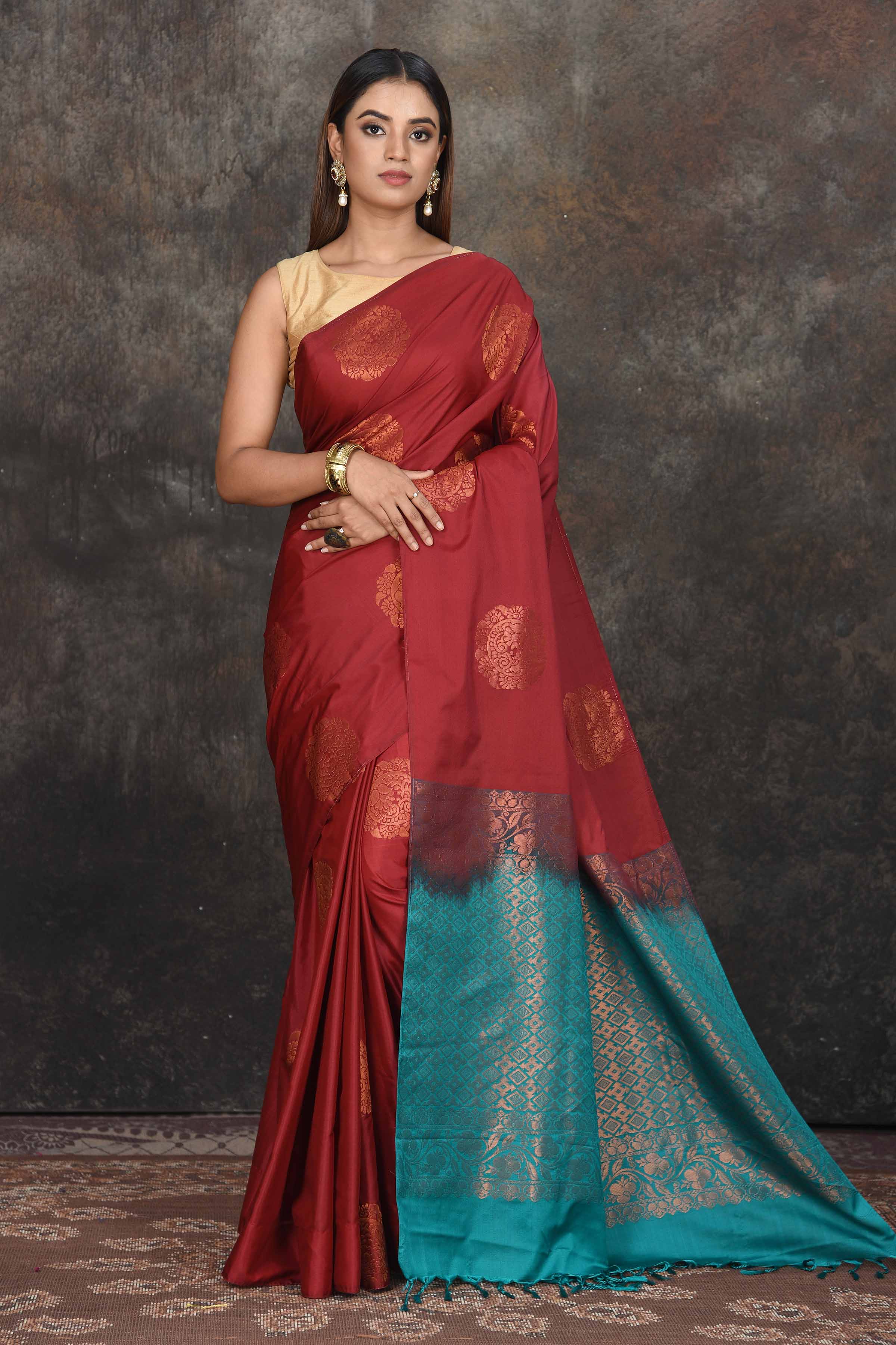 Shop beautiful maroon Kanjivaram soft silk sari online in USA with sea green zari pallu. Be the center of attraction on special occasions in ethnic sarees, designer sarees, embroidered sarees, handwoven sarees, pure silk sarees from Pure Elegance Indian saree store in USA.-full view