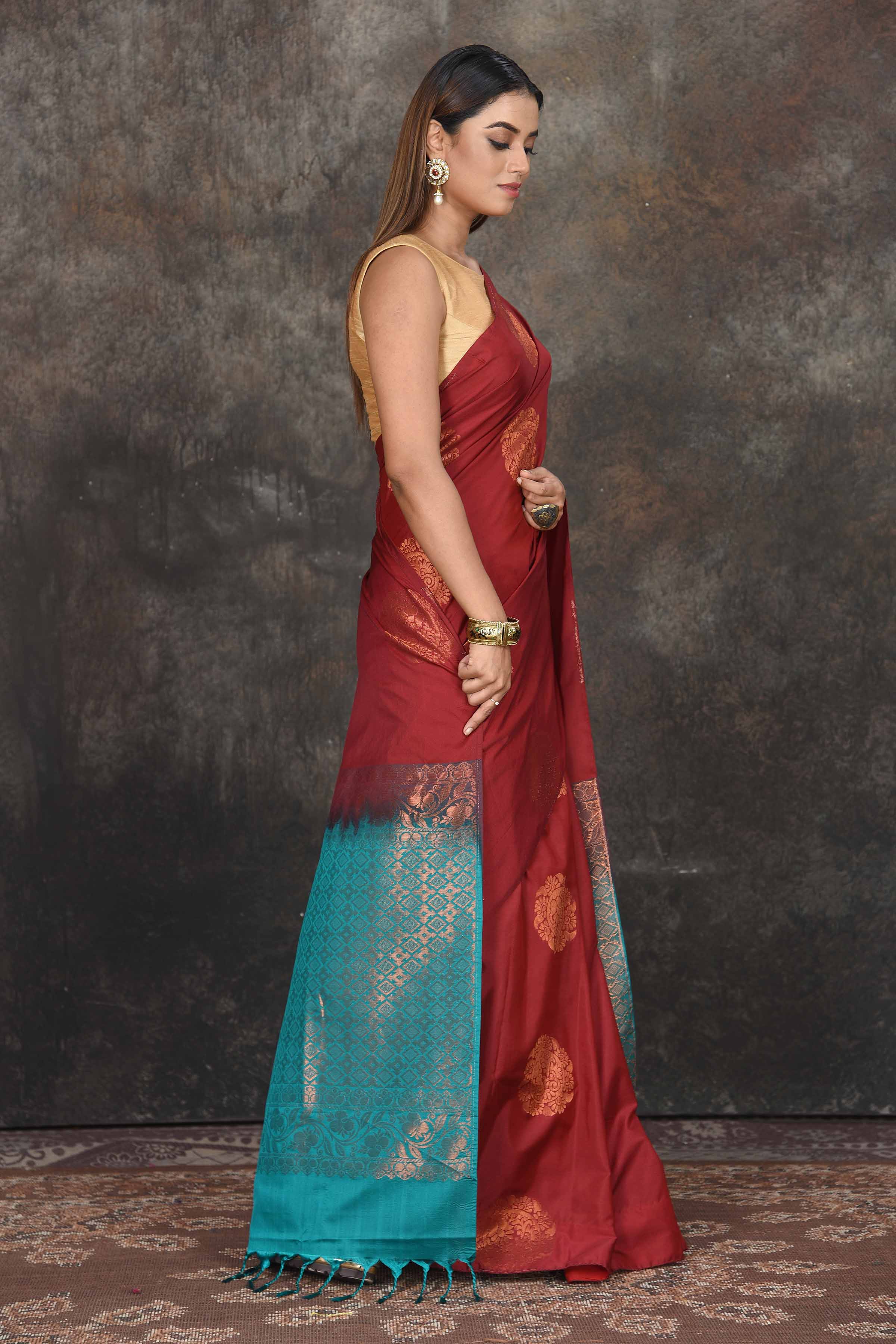Shop beautiful maroon Kanjivaram soft silk sari online in USA with sea green zari pallu. Be the center of attraction on special occasions in ethnic sarees, designer sarees, embroidered sarees, handwoven sarees, pure silk sarees from Pure Elegance Indian saree store in USA.-side