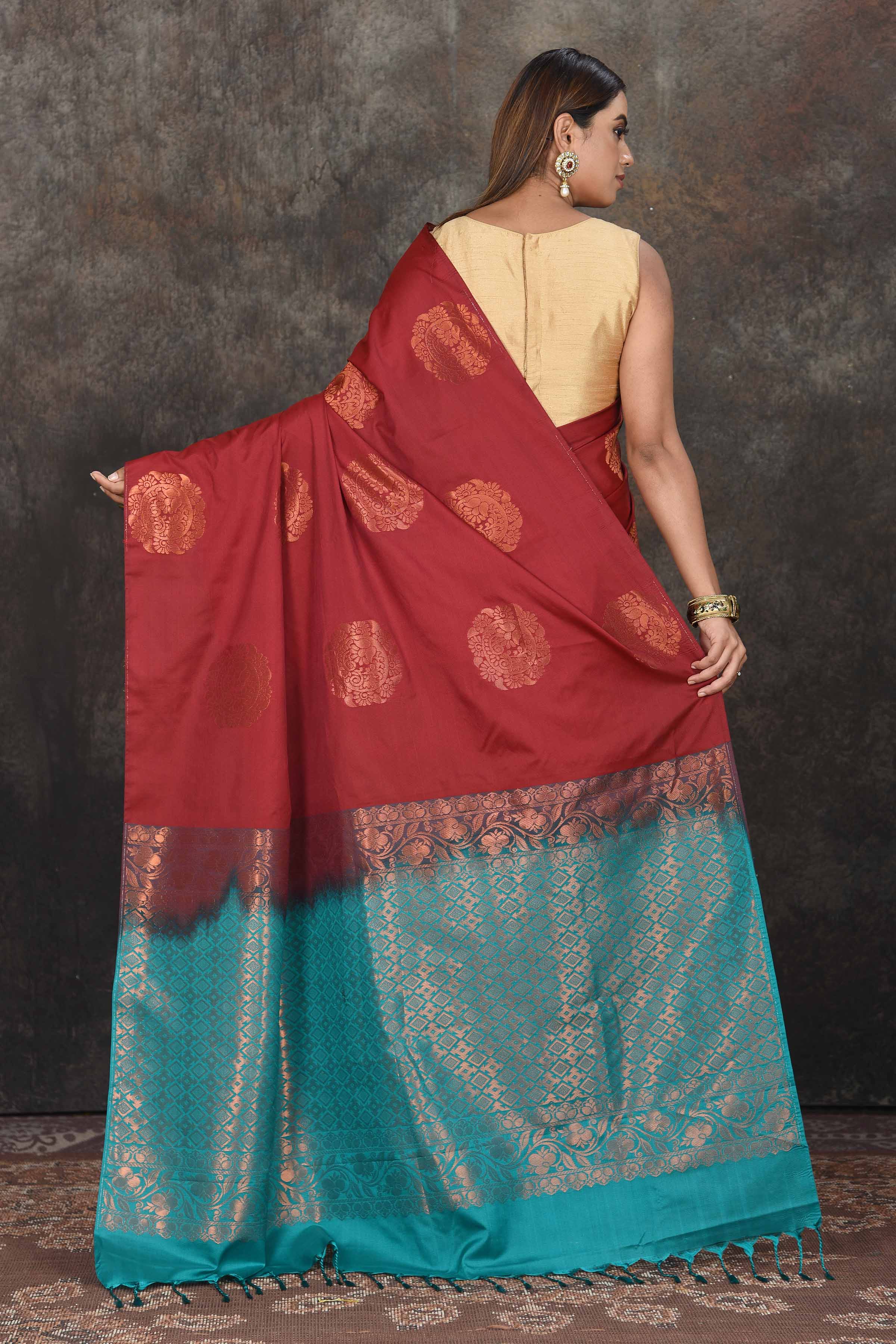 Shop beautiful maroon Kanjivaram soft silk sari online in USA with sea green zari pallu. Be the center of attraction on special occasions in ethnic sarees, designer sarees, embroidered sarees, handwoven sarees, pure silk sarees from Pure Elegance Indian saree store in USA.-back