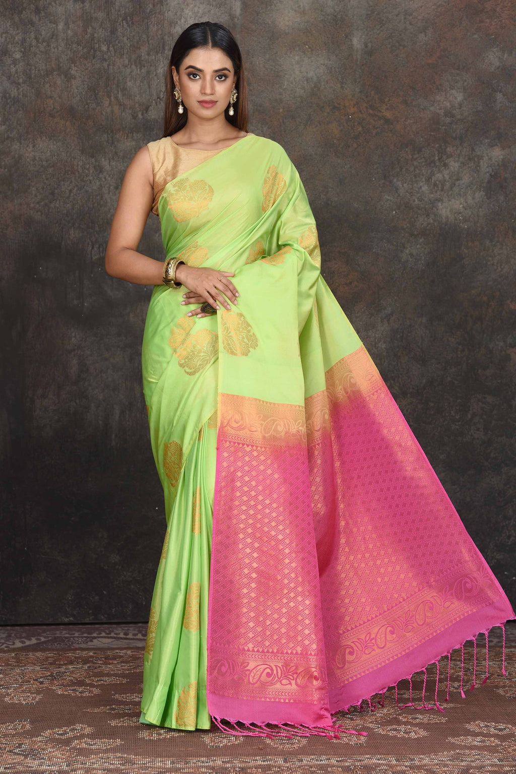 Buy beautiful pastel green Kanjivaram soft silk sari online in USA with pink zari pallu. Be the center of attraction on special occasions in ethnic sarees, designer sarees, embroidered sarees, handwoven sarees, pure silk sarees from Pure Elegance Indian saree store in USA.-full view