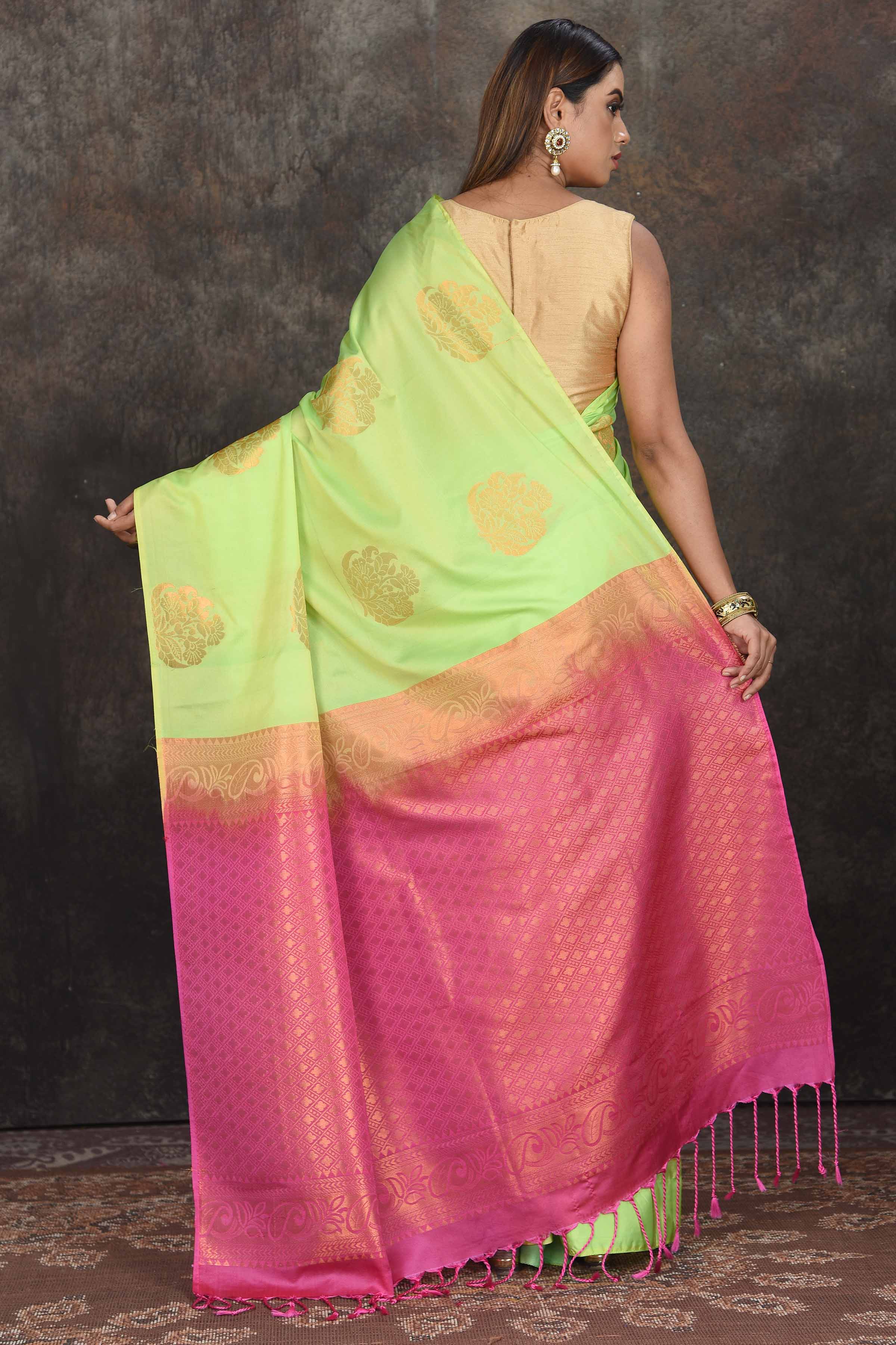 Buy beautiful pastel green Kanjivaram soft silk sari online in USA with pink zari pallu. Be the center of attraction on special occasions in ethnic sarees, designer sarees, embroidered sarees, handwoven sarees, pure silk sarees from Pure Elegance Indian saree store in USA.-back