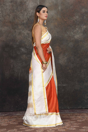 Buy beautiful rust orange Kanjeevaram sari online in USA with cream border. Go for a rich traditional look on weddings and festive occasions in pure silk sarees, Kanchipuram silk sarees, handloom sarees, Banarasi sarees from Pure Elegance Indian fashion store in USA.-side