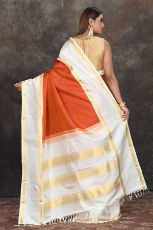 Buy beautiful rust orange Kanjeevaram sari online in USA with cream border. Go for a rich traditional look on weddings and festive occasions in pure silk sarees, Kanchipuram silk sarees, handloom sarees, Banarasi sarees from Pure Elegance Indian fashion store in USA.-back