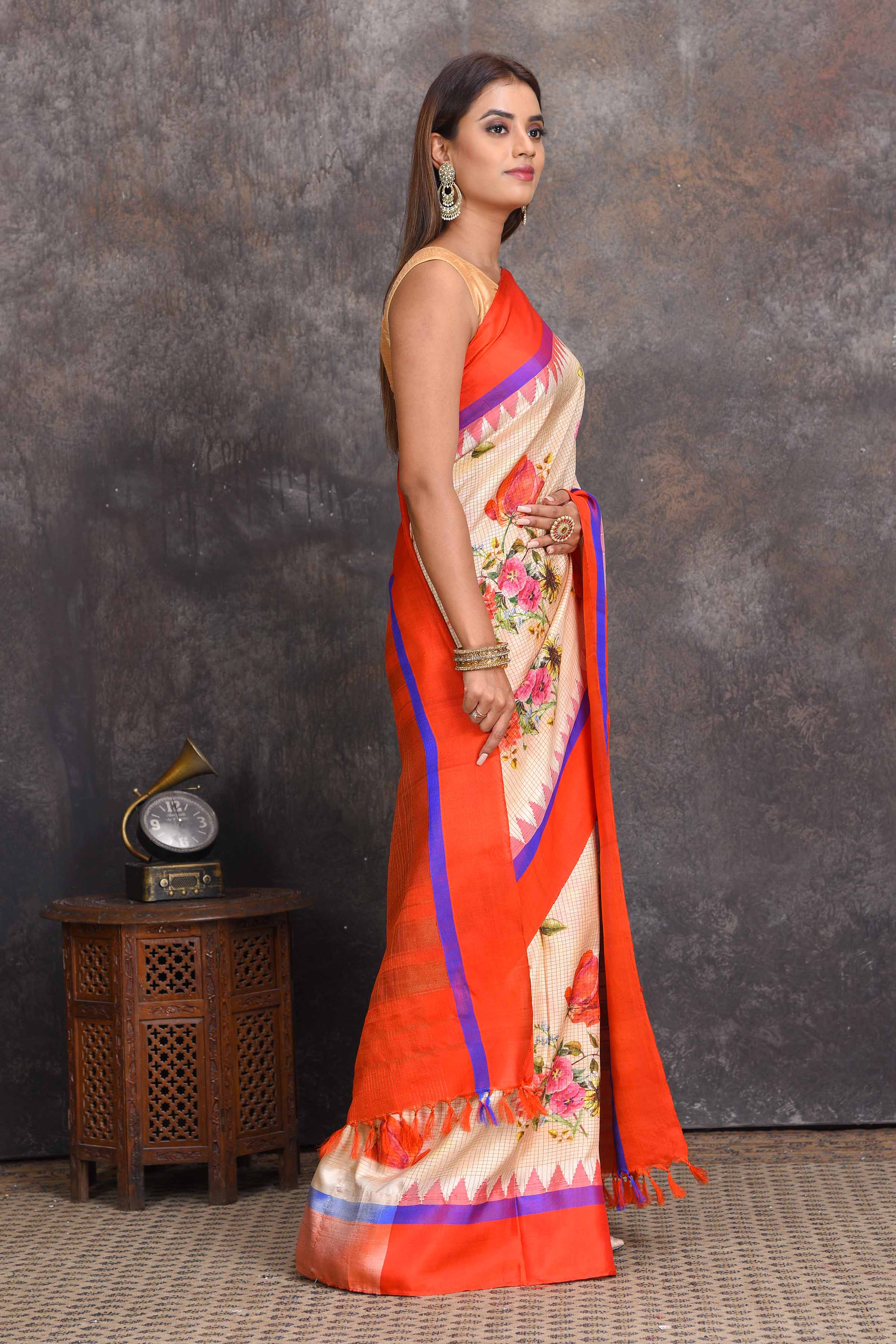 Buy stunning cream floral Gadhwal silk saree online in USA with red border. Get festive ready in beautiful Kanchipuram silk sarees, pure silk sarees, soft silk sarees, tussar silk saris, handwoven sarees, chanderi silk sarees from Pure Elegance Indian saree store in USA.-side