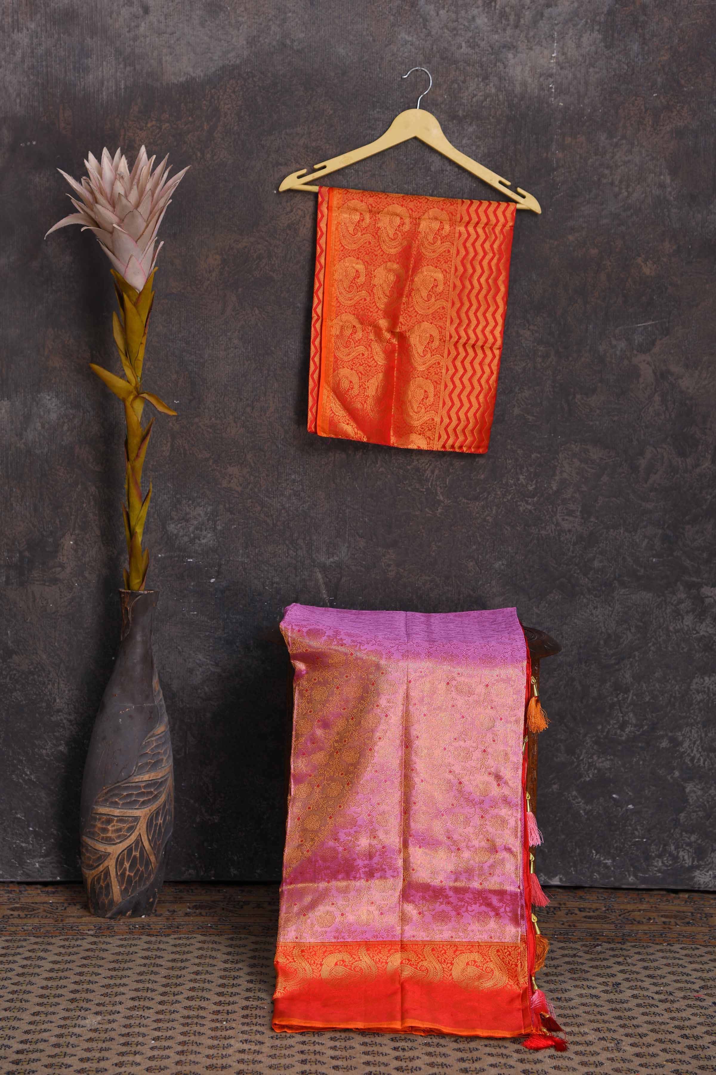 Buy beautiful lilac heavy Gadhwal silk saree online in USA with orange border. Get festive ready in beautiful Kanchipuram silk sarees, pure silk sarees, soft silk sarees, tussar silk saris, handwoven sarees, chanderi silk sarees from Pure Elegance Indian saree store in USA-blouse