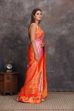 Buy beautiful lilac heavy Gadhwal silk saree online in USA with orange border. Get festive ready in beautiful Kanchipuram silk sarees, pure silk sarees, soft silk sarees, tussar silk saris, handwoven sarees, chanderi silk sarees from Pure Elegance Indian saree store in USA.-side