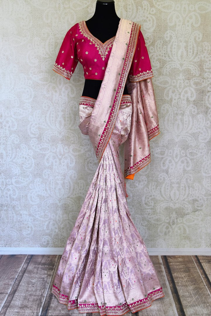 Shop lilac designer Banarasi saree online in USA with pink embroidered blouse. Look elegant on special occasions in beautiful printed sarees, silk sarees, tussar sarees, handloom sarees, Kanchipuram sarees from Pure Elegance Indian saree store in USA.-full view