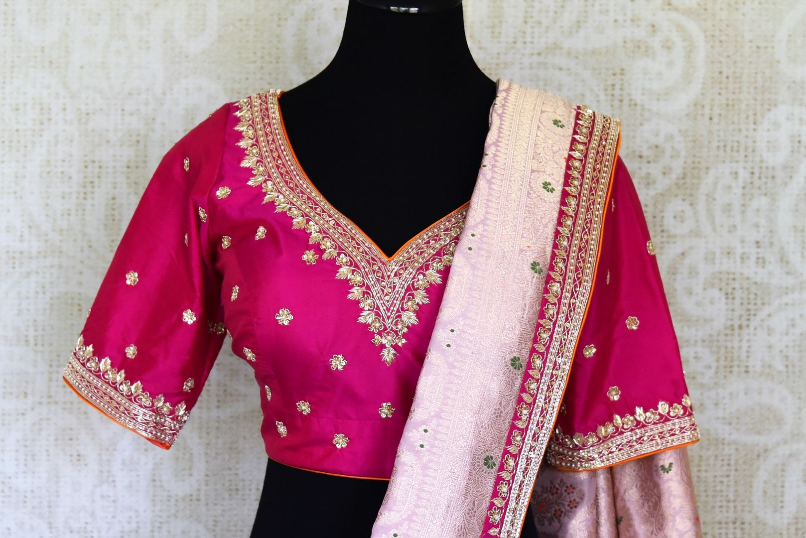 Shop lilac designer Banarasi saree online in USA with pink embroidered blouse. Look elegant on special occasions in beautiful printed sarees, silk sarees, tussar sarees, handloom sarees, Kanchipuram sarees from Pure Elegance Indian saree store in USA.-closeup
