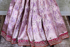 Shop lilac designer Banarasi saree online in USA with pink embroidered blouse. Look elegant on special occasions in beautiful printed sarees, silk sarees, tussar sarees, handloom sarees, Kanchipuram sarees from Pure Elegance Indian saree store in USA.-pleats