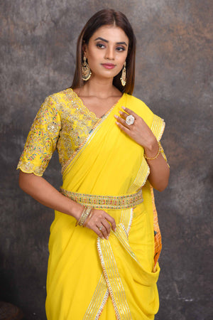 Buy beautiful yellow georgette saree online in USA with embroidered belt and blouse. Set a style statement on special occasions in exquisite designer sarees, handwoven sarees, georgette sarees, embroidered sarees, Banarasi saree, pure silk saris, tussar sarees from Pure Elegance Indian saree store in USA.-closeup