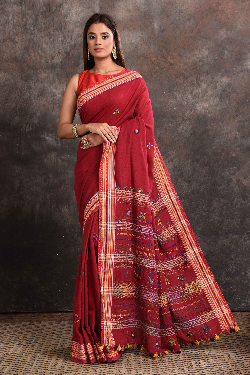 Buy beautiful blood red Lambani khaddi cotton saree online in USA. Look your ethnic best on festive occasions with latest designer sarees, pure silk sarees, Kanchipuram silk sarees, handwoven sarees, tussar silk sarees, embroidered sarees from Pure Elegance Indian saree store in USA.-full view