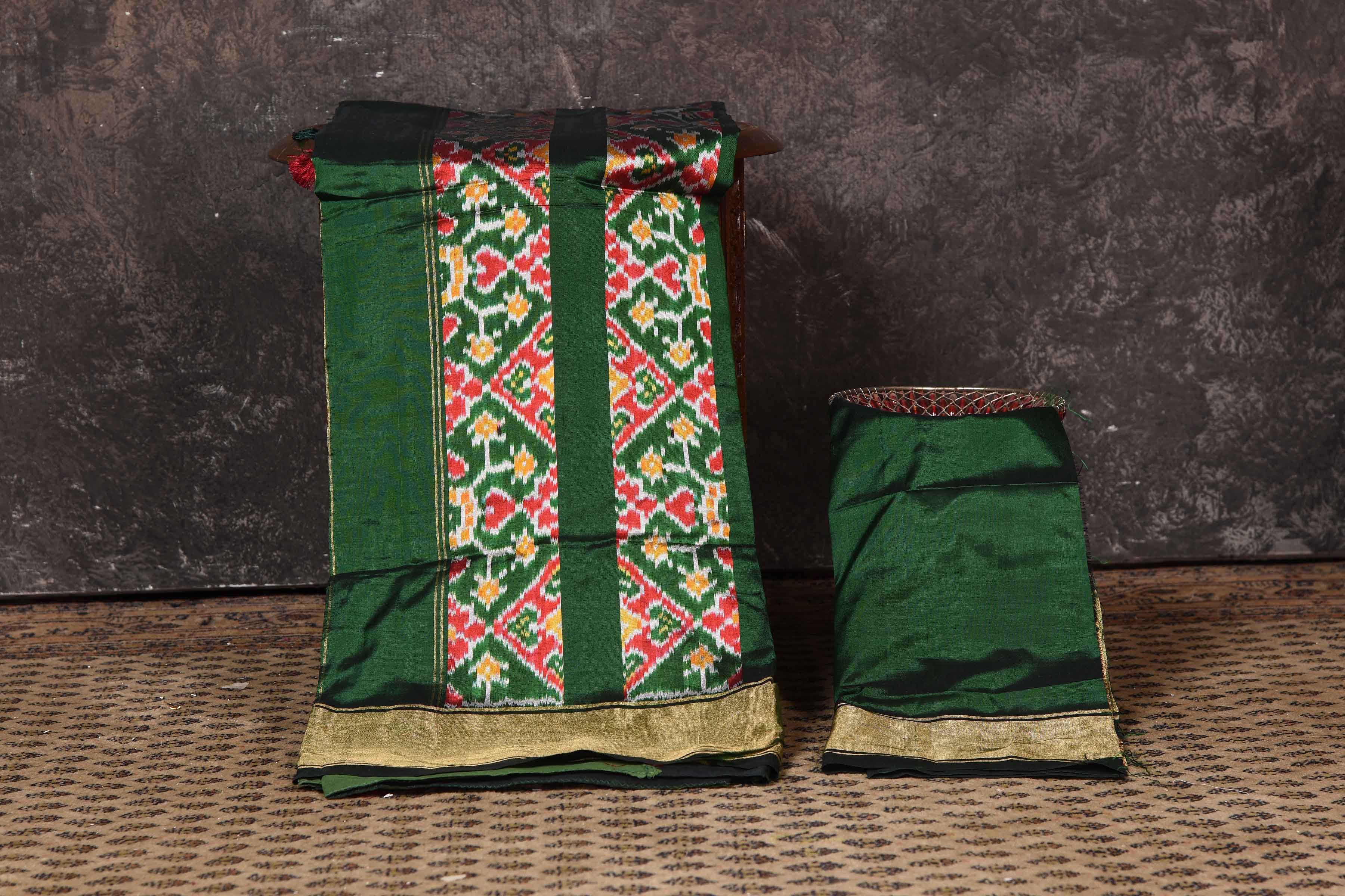 Buy stunning bottle green ikkat silk saree online in USA with zari border. Look your ethnic best on festive occasions with latest designer sarees, pure silk sarees, Kanchipuram silk sarees, handwoven sarees, tussar silk sarees, embroidered sarees from Pure Elegance Indian saree store in USA.-blouse