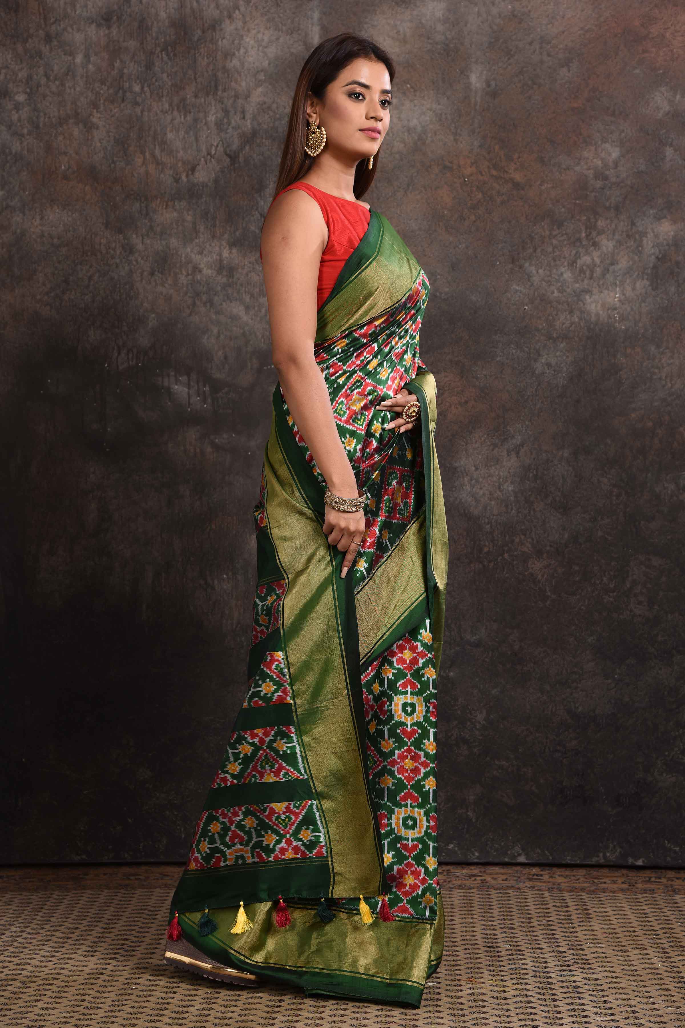 Buy stunning bottle green ikkat silk saree online in USA with zari border. Look your ethnic best on festive occasions with latest designer sarees, pure silk sarees, Kanchipuram silk sarees, handwoven sarees, tussar silk sarees, embroidered sarees from Pure Elegance Indian saree store in USA.-side