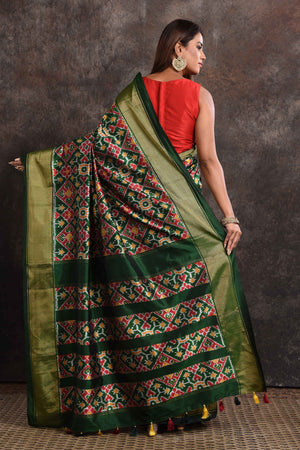 Buy stunning bottle green ikkat silk saree online in USA with zari border. Look your ethnic best on festive occasions with latest designer sarees, pure silk sarees, Kanchipuram silk sarees, handwoven sarees, tussar silk sarees, embroidered sarees from Pure Elegance Indian saree store in USA.-back