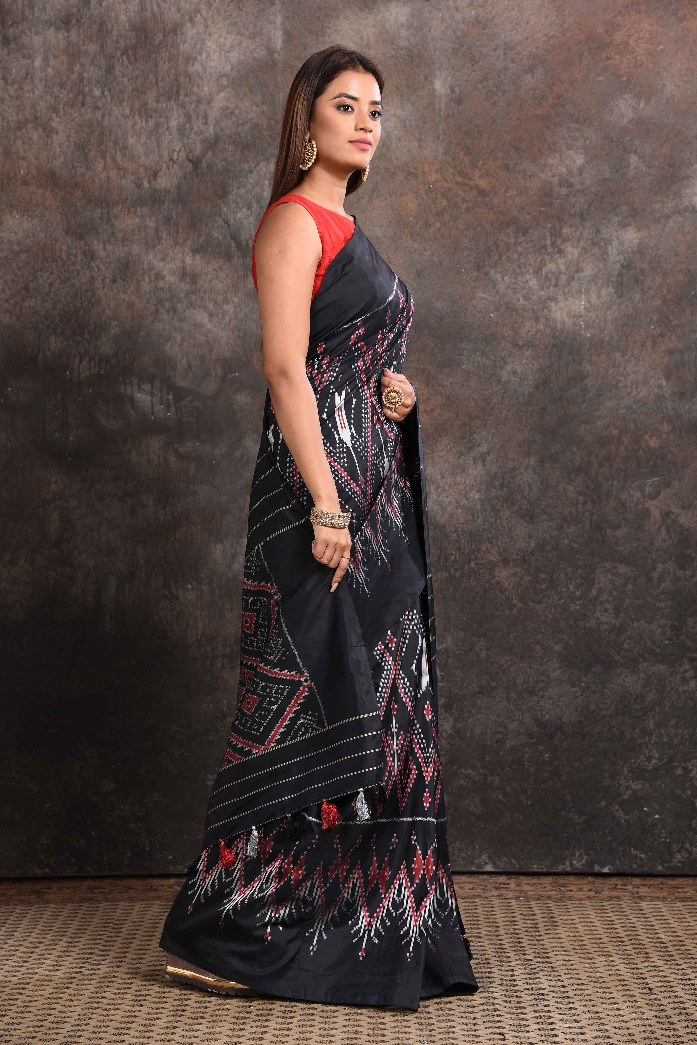 Buy beautiful black ikkat silk saree online in USA with zari stripes pallu. Look your ethnic best on festive occasions with latest designer sarees, pure silk sarees, Kanchipuram silk sarees, handwoven sarees, tussar silk sarees, embroidered sarees from Pure Elegance Indian saree store in USA.-side