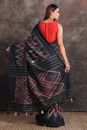 Buy beautiful black ikkat silk saree online in USA with zari stripes pallu. Look your ethnic best on festive occasions with latest designer sarees, pure silk sarees, Kanchipuram silk sarees, handwoven sarees, tussar silk sarees, embroidered sarees from Pure Elegance Indian saree store in USA.-back