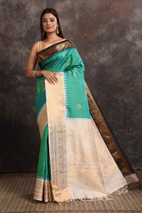 Buy stunning sea green Gadhwal silk sari online in USA with black and cream zari border. Look your ethnic best on festive occasions with latest designer sarees, pure silk sarees, Kanchipuram silk sarees, handwoven sarees, tussar silk sarees, embroidered sarees from Pure Elegance Indian saree store in USA.-full view