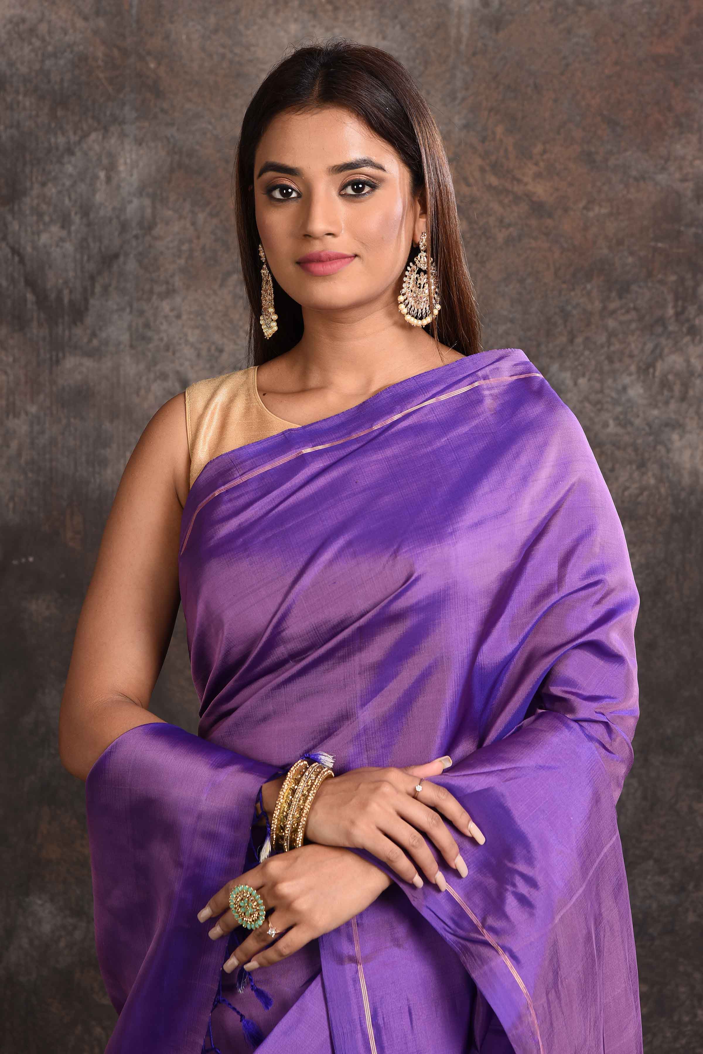 Buy stunning purple borderless Kanjeevaram silk sari online in USA. Keep your ethnic wardrobe up to date with latest designer sarees, pure silk sarees, Kanchipuram silk sarees, handwoven sarees, tussar silk sarees, embroidered sarees from Pure Elegance Indian saree store in USA.-closeup