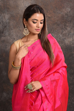 Shop bright pink borderless Kanjeevaram silk sari online in USA. Keep your ethnic wardrobe up to date with latest designer sarees, pure silk sarees, Kanchipuram silk sarees, handwoven sarees, tussar silk sarees, embroidered sarees from Pure Elegance Indian saree store in USA.-closeup