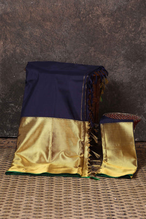 Buy beautiful navy and golden zari border Kanjeevaram silk sari online in USA. Keep your ethnic wardrobe up to date with latest designer sarees, pure silk sarees, Kanchipuram silk sarees, handwoven sarees, tussar silk sarees, embroidered sarees from Pure Elegance Indian saree store in USA.-blouse