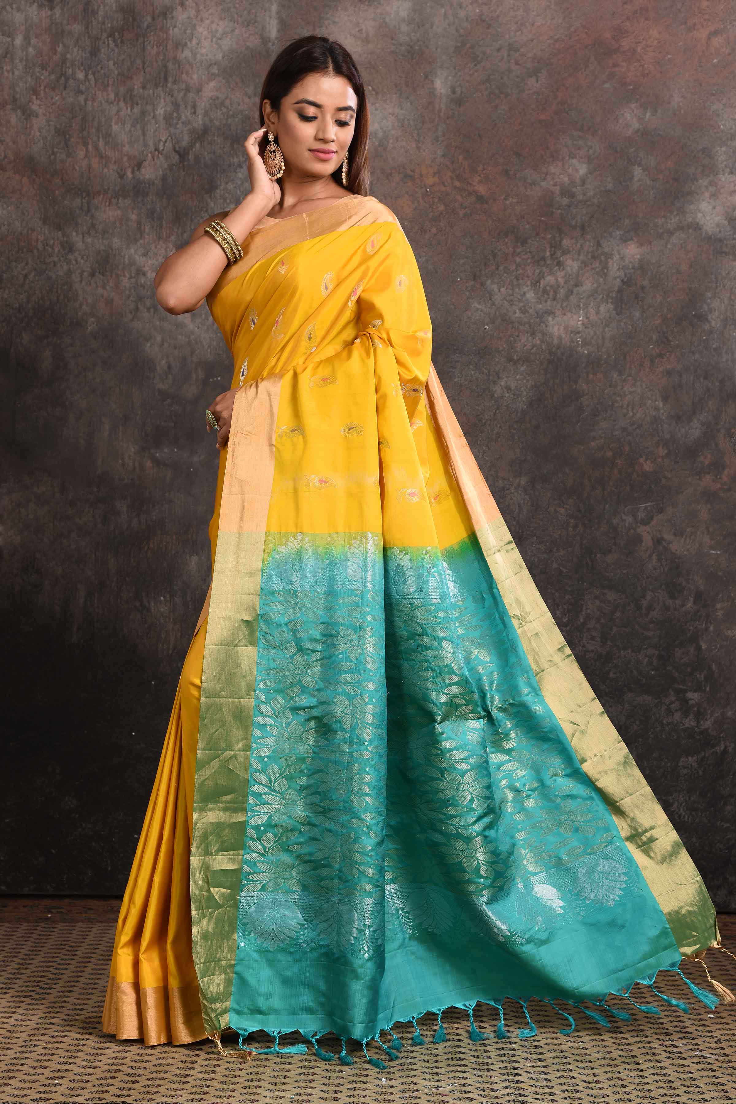 Buy stunning yellow Kanjeevaram silk sari online in USA with blue zari pallu. Keep your ethnic wardrobe up to date with latest designer sarees, pure silk sarees, Kanchipuram silk sarees, handwoven sarees, tussar silk sarees, embroidered sarees from Pure Elegance Indian saree store in USA.-pallu