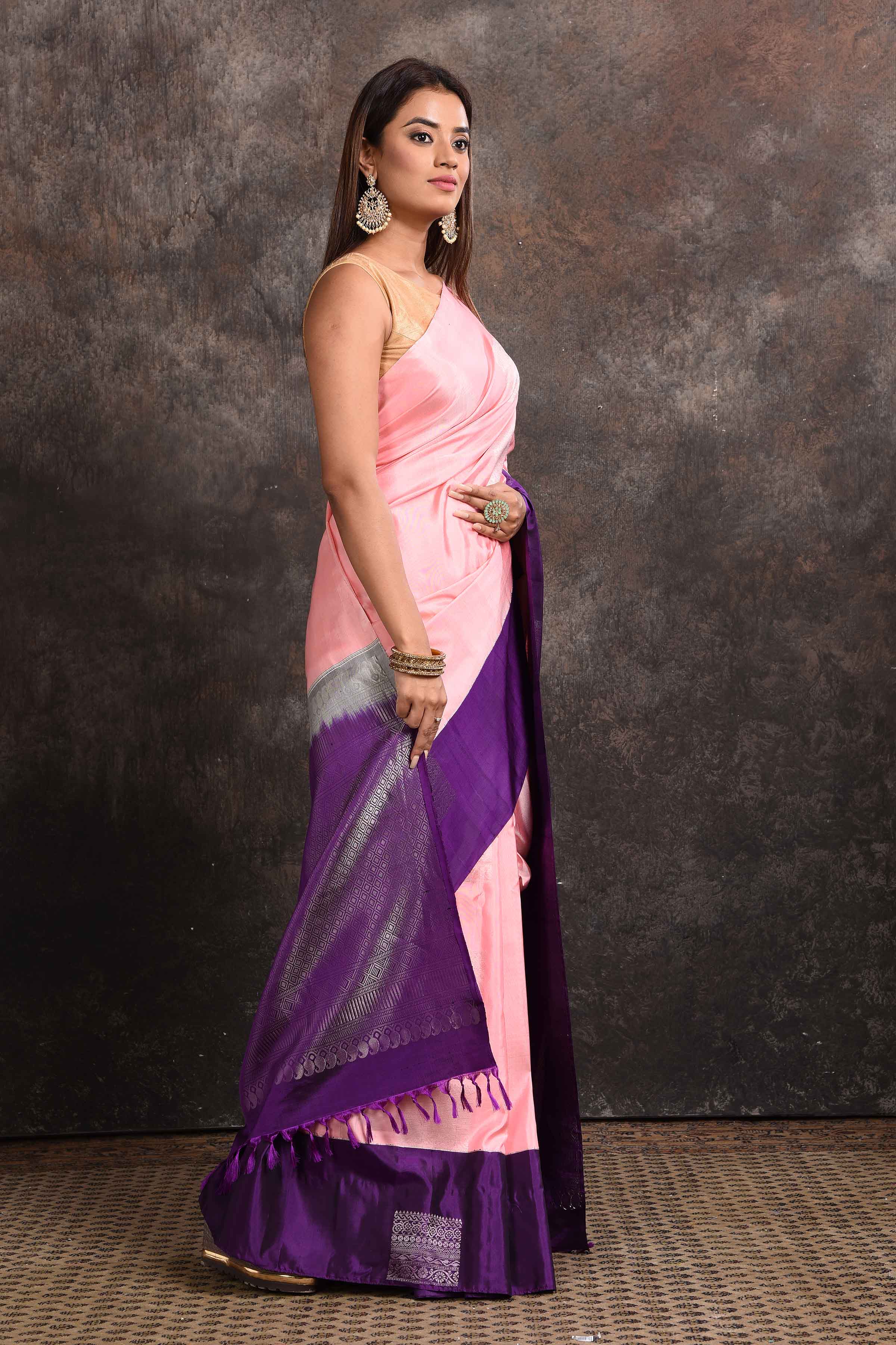 Shop beautiful pastel pink Kanjeevaram silk sari online in USA with purple zari border. Keep your ethnic wardrobe up to date with latest designer sarees, pure silk sarees, Kanchipuram silk sarees, handwoven sarees, tussar silk sarees, embroidered sarees from Pure Elegance Indian saree store in USA.-side