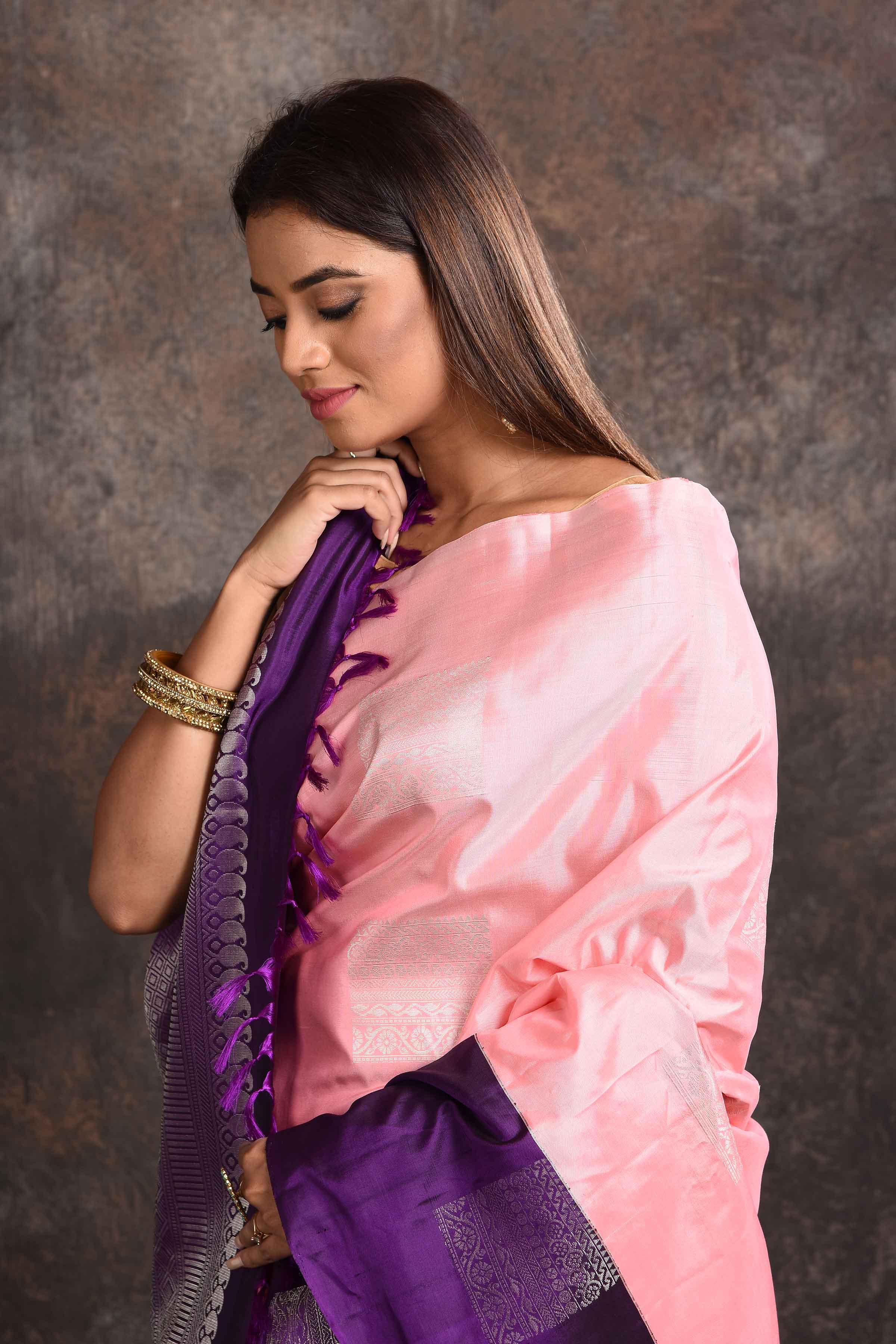 Shop beautiful pastel pink Kanjeevaram silk sari online in USA with purple zari border. Keep your ethnic wardrobe up to date with latest designer sarees, pure silk sarees, Kanchipuram silk sarees, handwoven sarees, tussar silk sarees, embroidered sarees from Pure Elegance Indian saree store in USA.-closeup