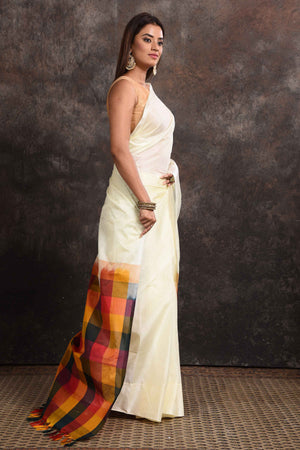 Buy beautiful off-white Kanjeevaram silk sari online in USA with multicolor check border. Keep your ethnic wardrobe up to date with latest designer sarees, pure silk sarees, Kanchipuram silk sarees, handwoven sarees, tussar silk sarees, embroidered sarees from Pure Elegance Indian saree store in USA.-side
