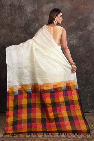 Buy beautiful off-white Kanjeevaram silk sari online in USA with multicolor check border. Keep your ethnic wardrobe up to date with latest designer sarees, pure silk sarees, Kanchipuram silk sarees, handwoven sarees, tussar silk sarees, embroidered sarees from Pure Elegance Indian saree store in USA.-back