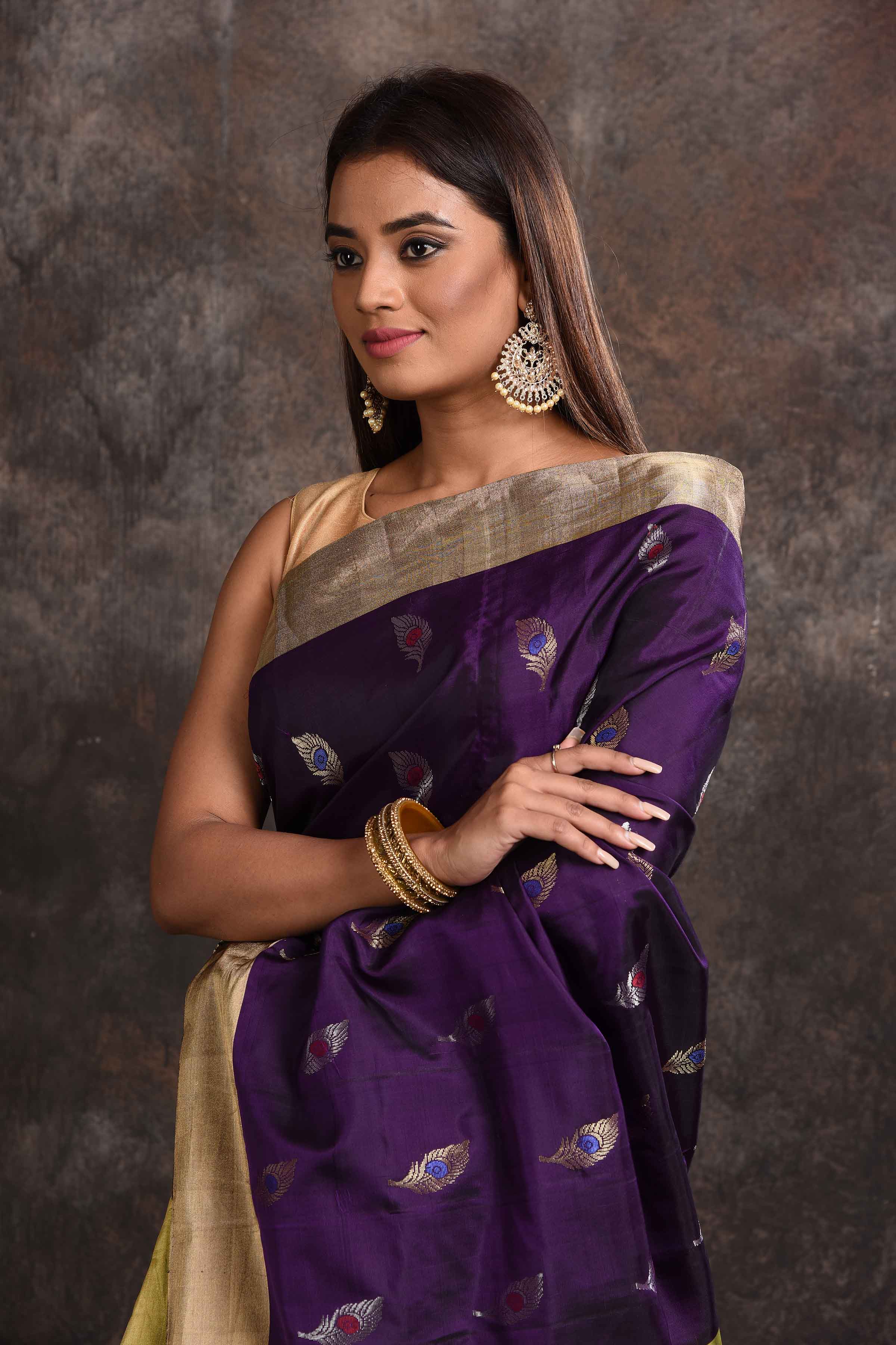 Shop beautiful purple Kanjeevaram silk saree online in USA with yellow zari pallu. Keep your ethnic wardrobe up to date with latest designer sarees, pure silk sarees, Kanchipuram silk sarees, handwoven sarees, tussar silk sarees, embroidered sarees from Pure Elegance Indian saree store in USA.-closeup