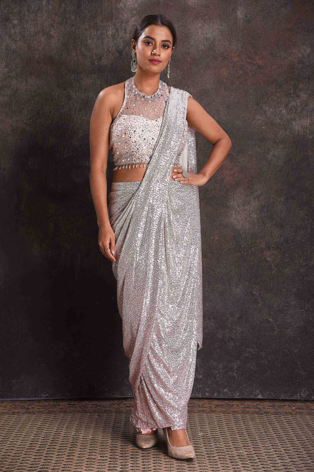 Buy silver sequin draped saree online in USA with designer blouse. Look your ethnic best on festive occasions with latest designer sarees, pure silk sarees, Kanchipuram silk sarees, designer dresses, Anarkali suits, gown, embroidered sarees from Pure Elegance Indian fashion store in USA.-full view