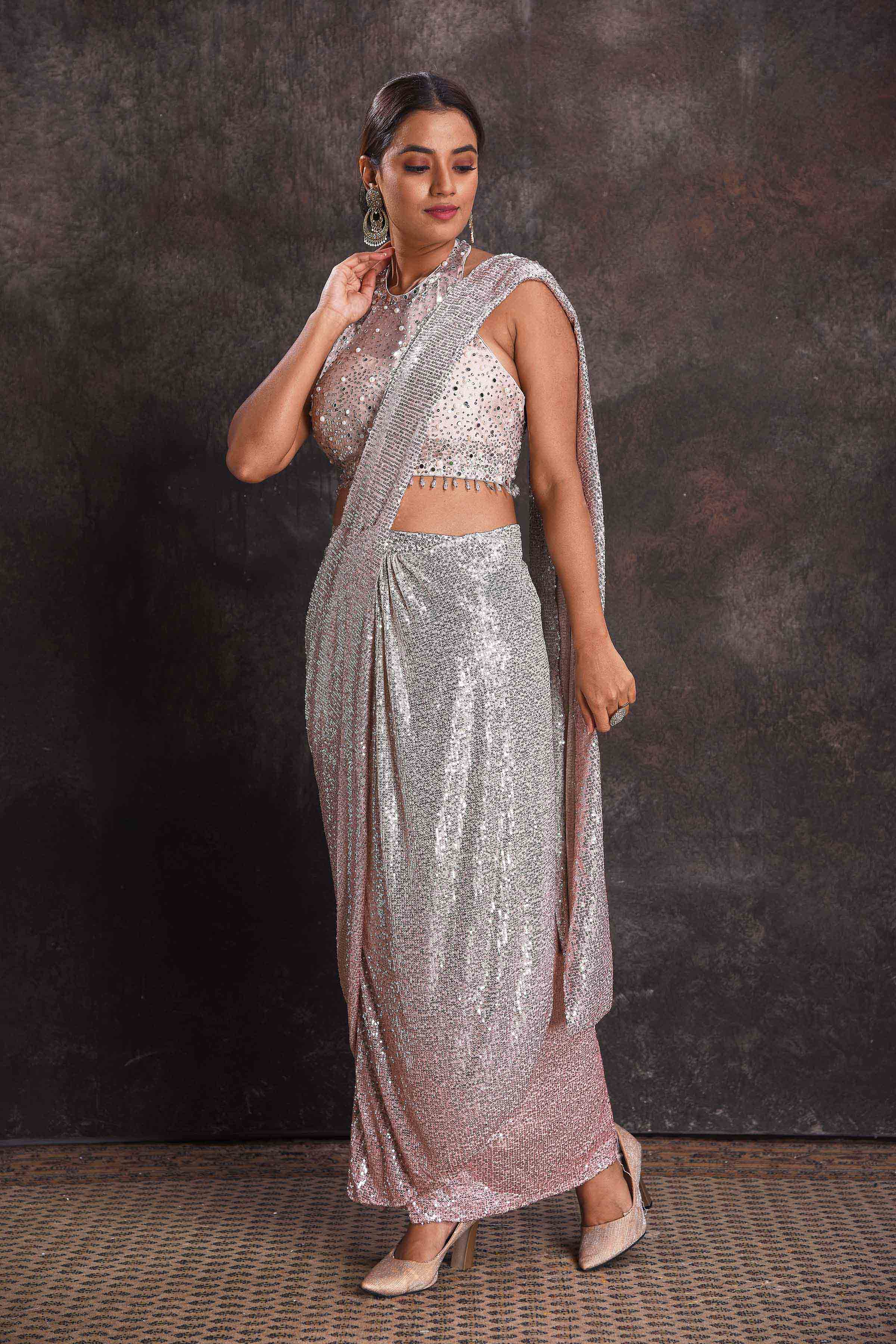 Buy silver sequin draped saree online in USA with designer blouse. Look your ethnic best on festive occasions with latest designer sarees, pure silk sarees, Kanchipuram silk sarees, designer dresses, Anarkali suits, gown, embroidered sarees from Pure Elegance Indian fashion store in USA.-pallu