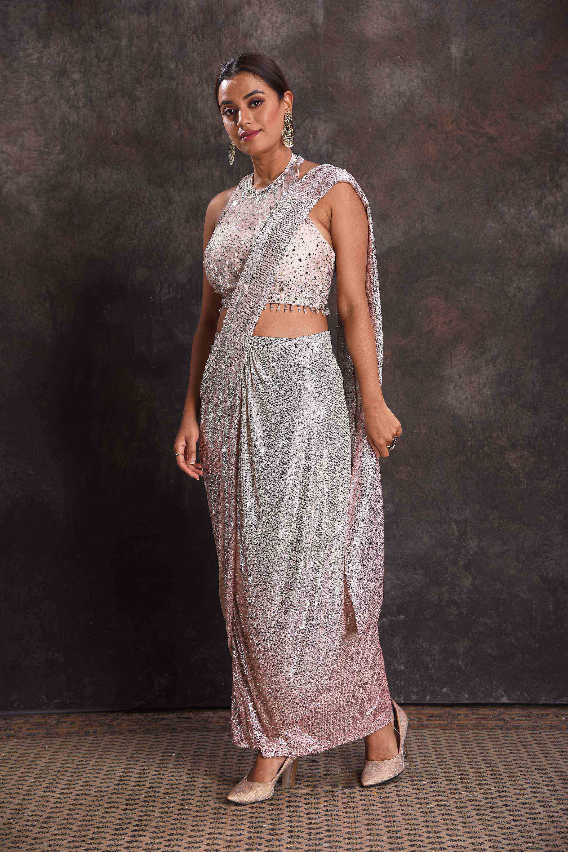 Buy silver sequin draped saree online in USA with designer blouse. Look your ethnic best on festive occasions with latest designer sarees, pure silk sarees, Kanchipuram silk sarees, designer dresses, Anarkali suits, gown, embroidered sarees from Pure Elegance Indian fashion store in USA.-side