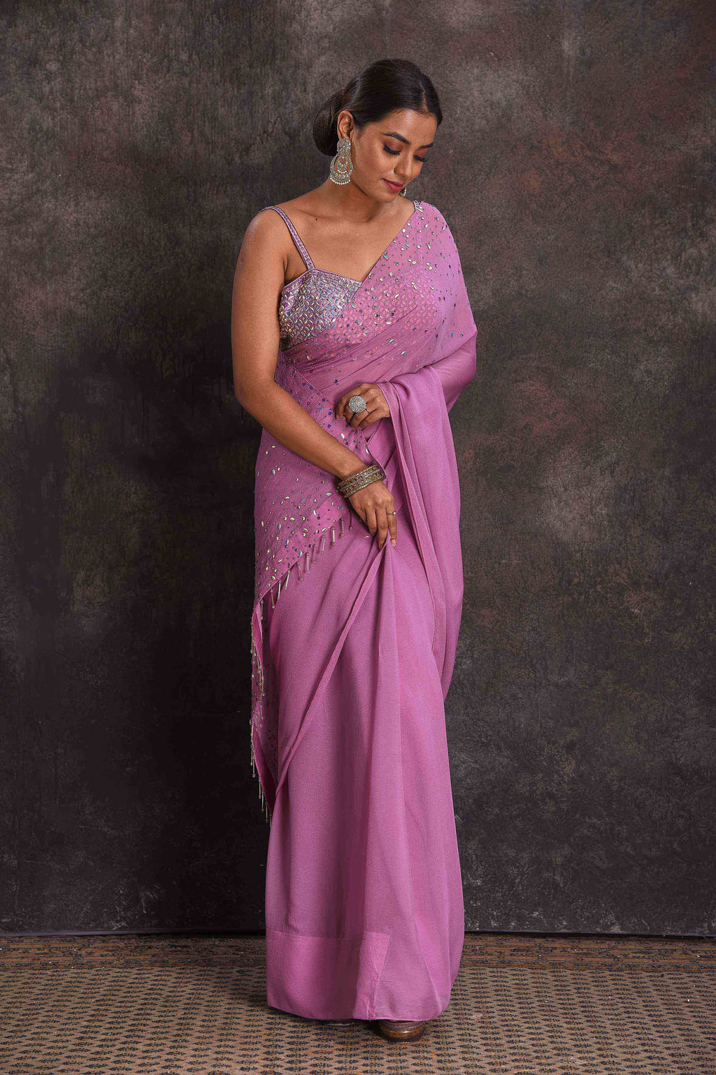 Shop beautiful lavender embroidered georgette saree online in USA with designer blouse. Look your ethnic best on festive occasions with latest designer sarees, pure silk sarees, Kanchipuram silk sarees, designer dresses, Anarkali suits, gown, embroidered sarees from Pure Elegance Indian fashion store in USA.-full view
