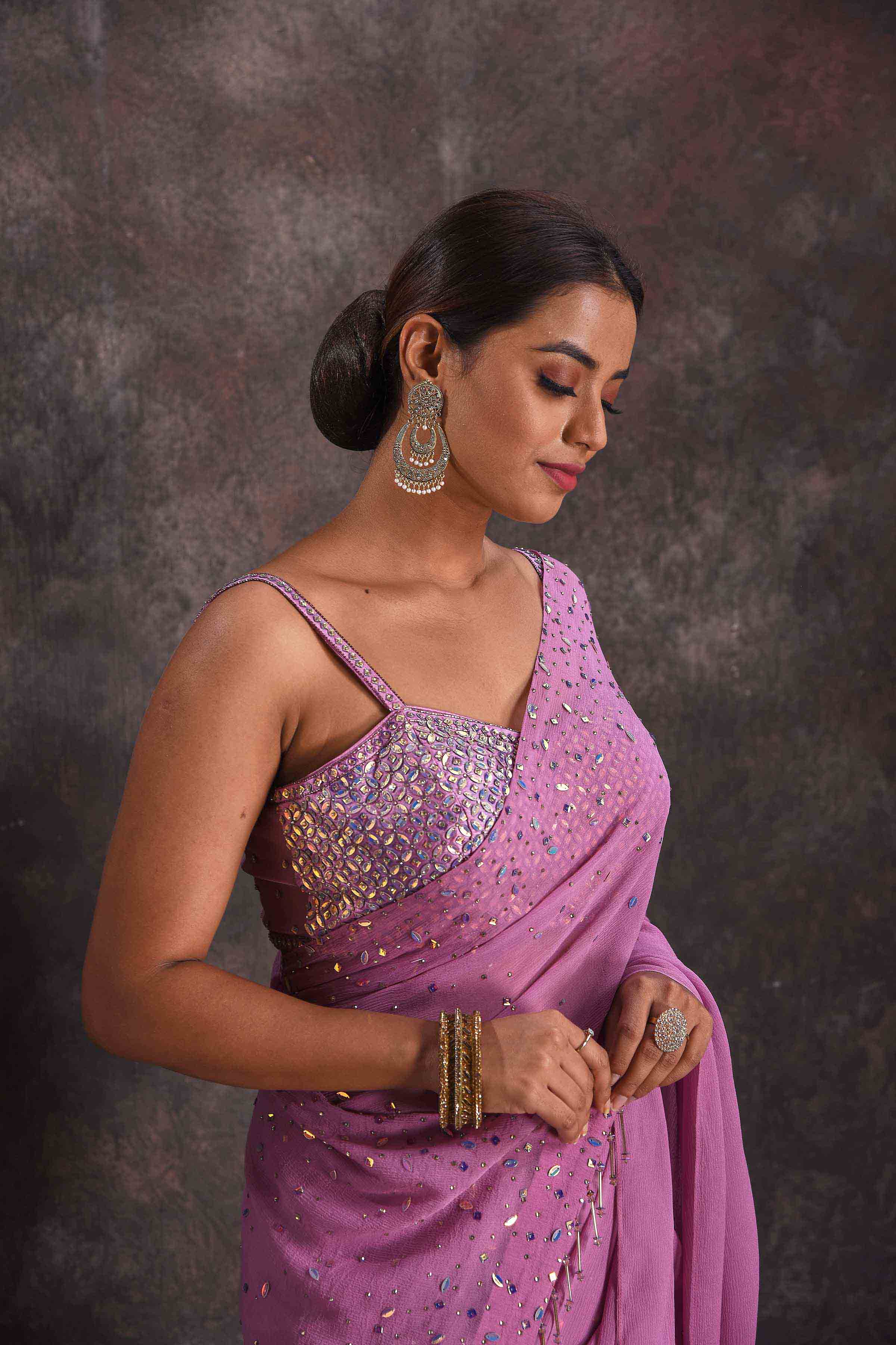 Shop beautiful lavender embroidered georgette saree online in USA with designer blouse. Look your ethnic best on festive occasions with latest designer sarees, pure silk sarees, Kanchipuram silk sarees, designer dresses, Anarkali suits, gown, embroidered sarees from Pure Elegance Indian fashion store in USA.-closeup