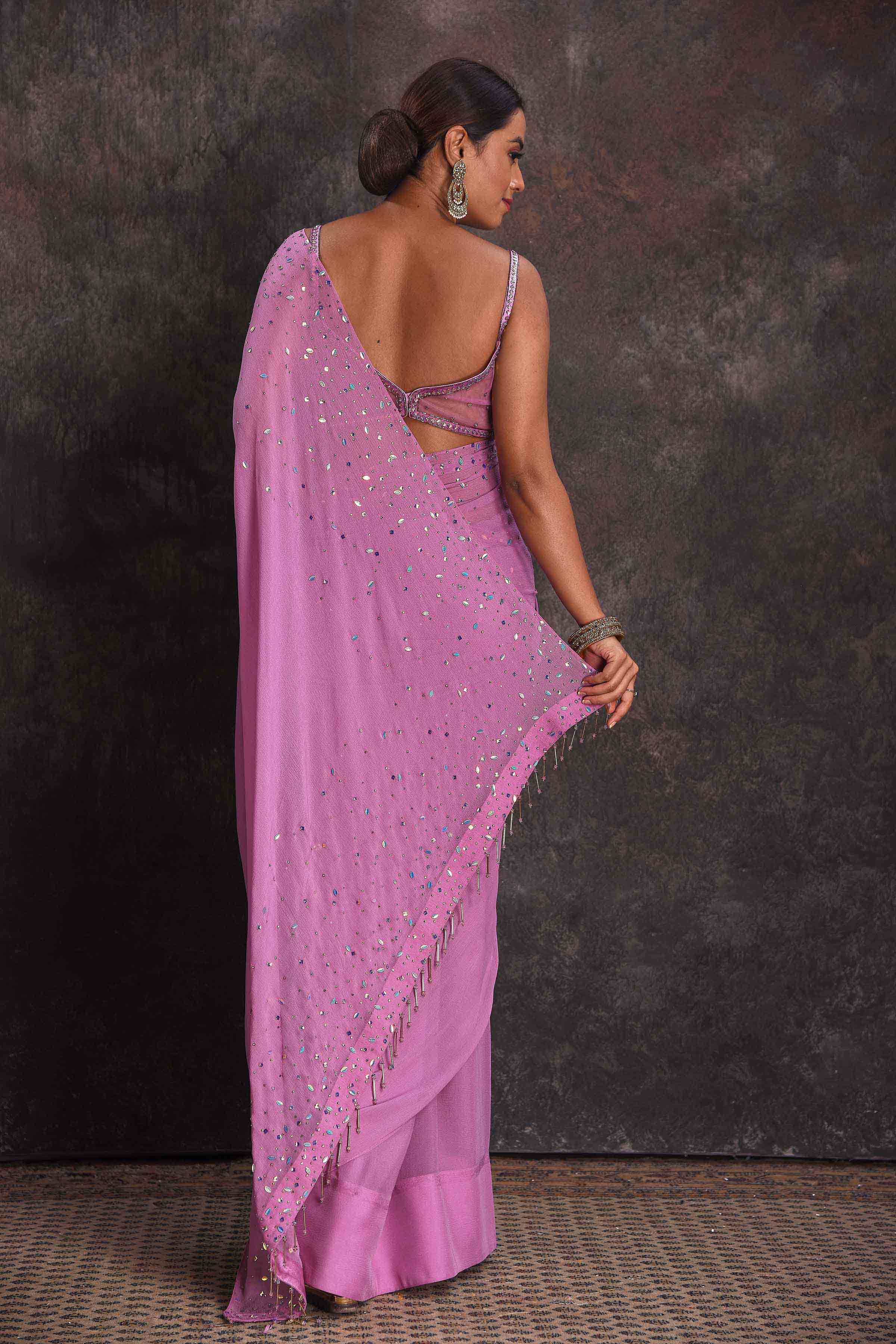 Shop beautiful lavender embroidered georgette saree online in USA with designer blouse. Look your ethnic best on festive occasions with latest designer sarees, pure silk sarees, Kanchipuram silk sarees, designer dresses, Anarkali suits, gown, embroidered sarees from Pure Elegance Indian fashion store in USA.-back