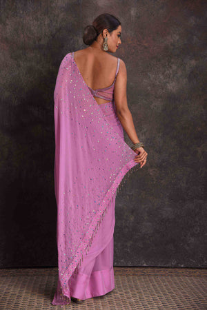 Shop beautiful lavender embroidered georgette saree online in USA with designer blouse. Look your ethnic best on festive occasions with latest designer sarees, pure silk sarees, Kanchipuram silk sarees, designer dresses, Anarkali suits, gown, embroidered sarees from Pure Elegance Indian fashion store in USA.-back