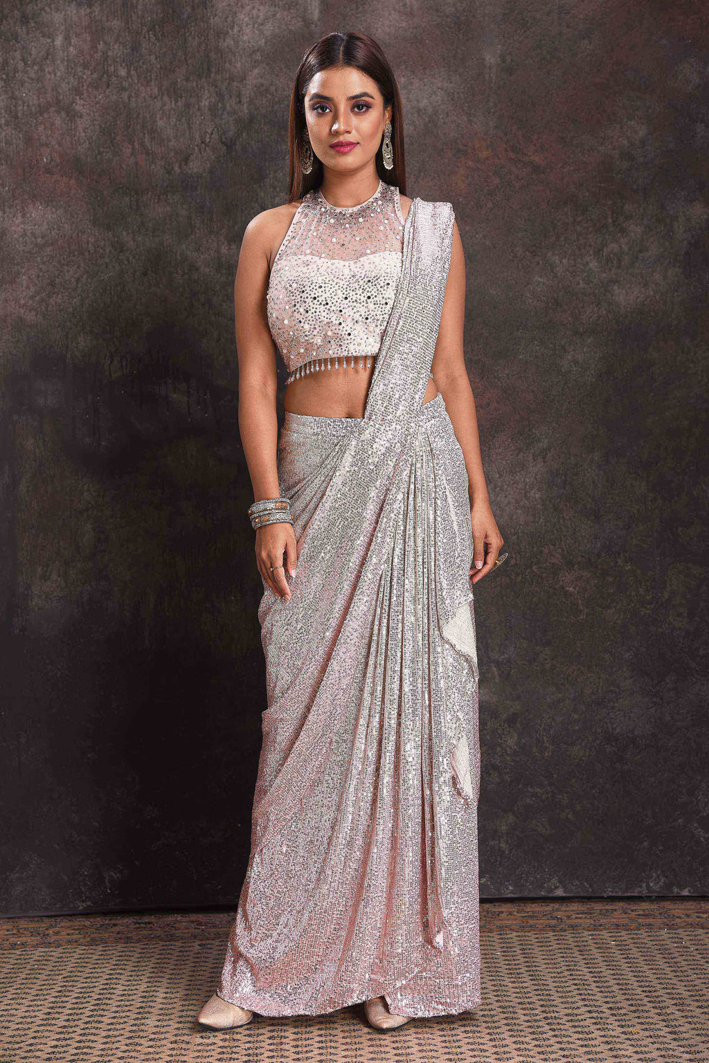 Buy beautiful silver sequin georgette pre-draped saree online in USA with designer blouse. Look your ethnic best on festive occasions with latest designer sarees, pure silk sarees, Kanchipuram silk sarees, designer dresses, Anarkali suits, gown, embroidered sarees from Pure Elegance Indian fashion store in USA.-full view
