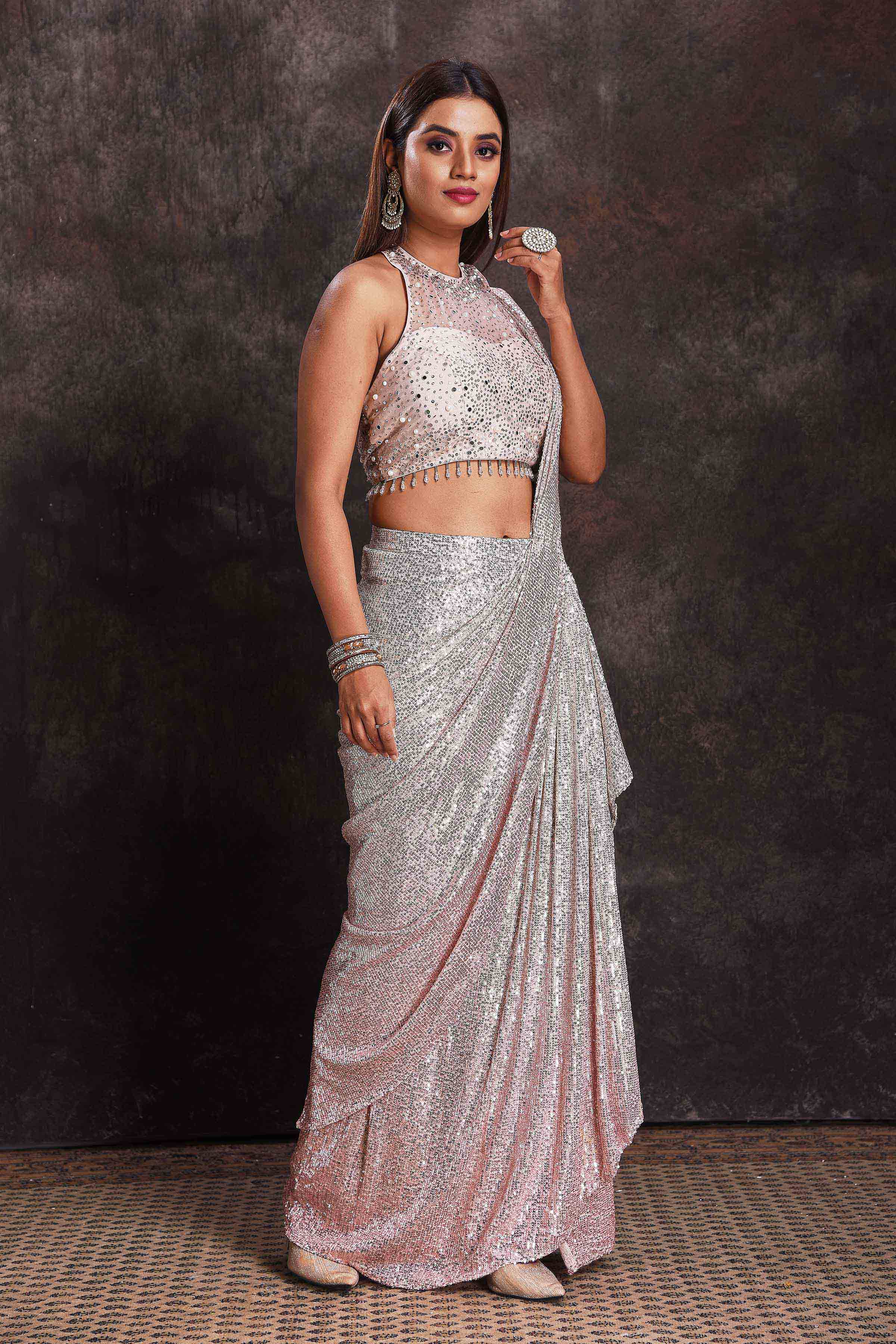Buy beautiful silver sequin georgette pre-draped saree online in USA with designer blouse. Look your ethnic best on festive occasions with latest designer sarees, pure silk sarees, Kanchipuram silk sarees, designer dresses, Anarkali suits, gown, embroidered sarees from Pure Elegance Indian fashion store in USA.-right