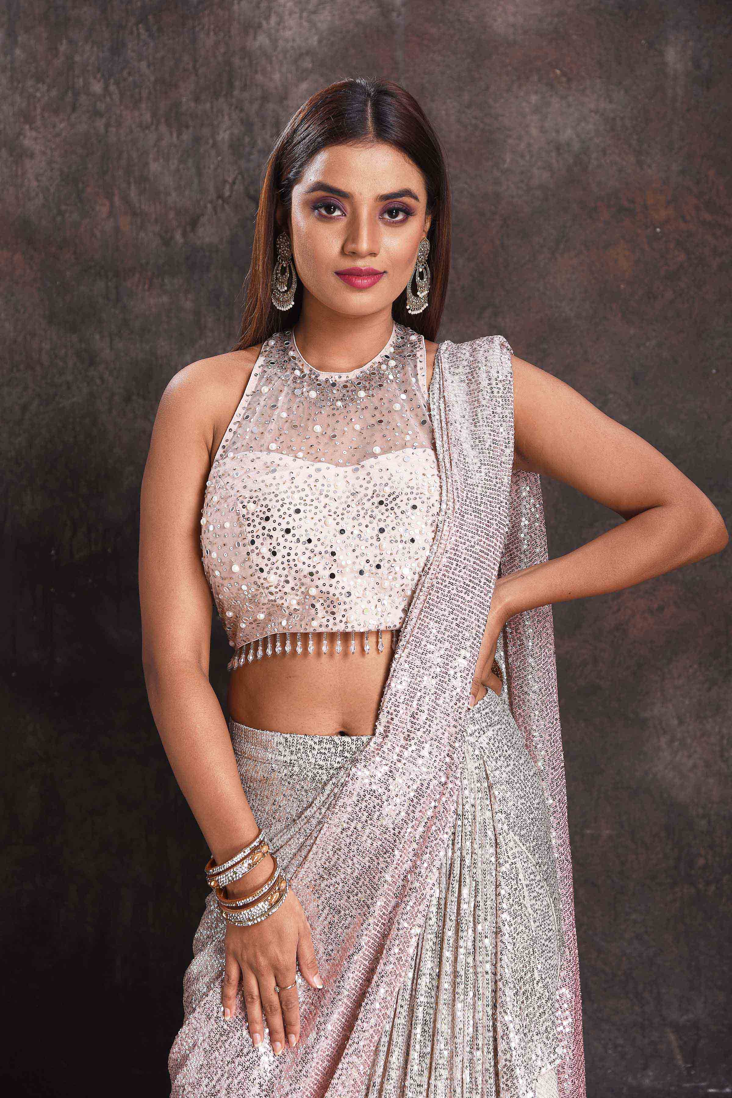 Buy beautiful silver sequin georgette pre-draped saree online in USA with designer blouse. Look your ethnic best on festive occasions with latest designer sarees, pure silk sarees, Kanchipuram silk sarees, designer dresses, Anarkali suits, gown, embroidered sarees from Pure Elegance Indian fashion store in USA.-closeup