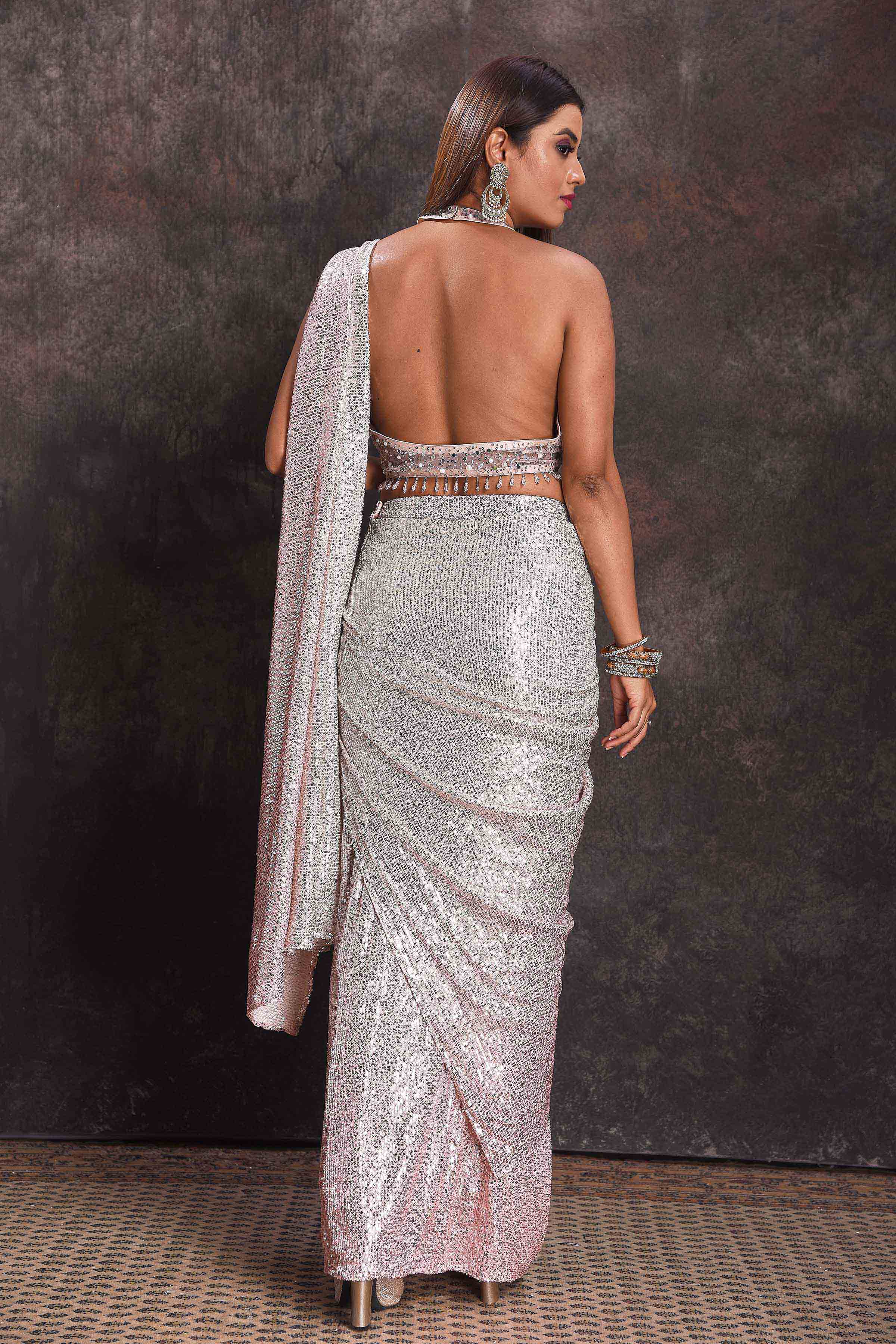 Buy beautiful silver sequin georgette pre-draped saree online in USA with designer blouse. Look your ethnic best on festive occasions with latest designer sarees, pure silk sarees, Kanchipuram silk sarees, designer dresses, Anarkali suits, gown, embroidered sarees from Pure Elegance Indian fashion store in USA.-back
