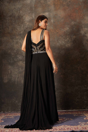 Shop stunning black embroidered designer gown saree online in USA. Look stylish at parties and special occasions in beautiful designer sarees, embroidered sarees, handwoven silk, party sarees from Pure Elegance Indian fashion store in USA.-back