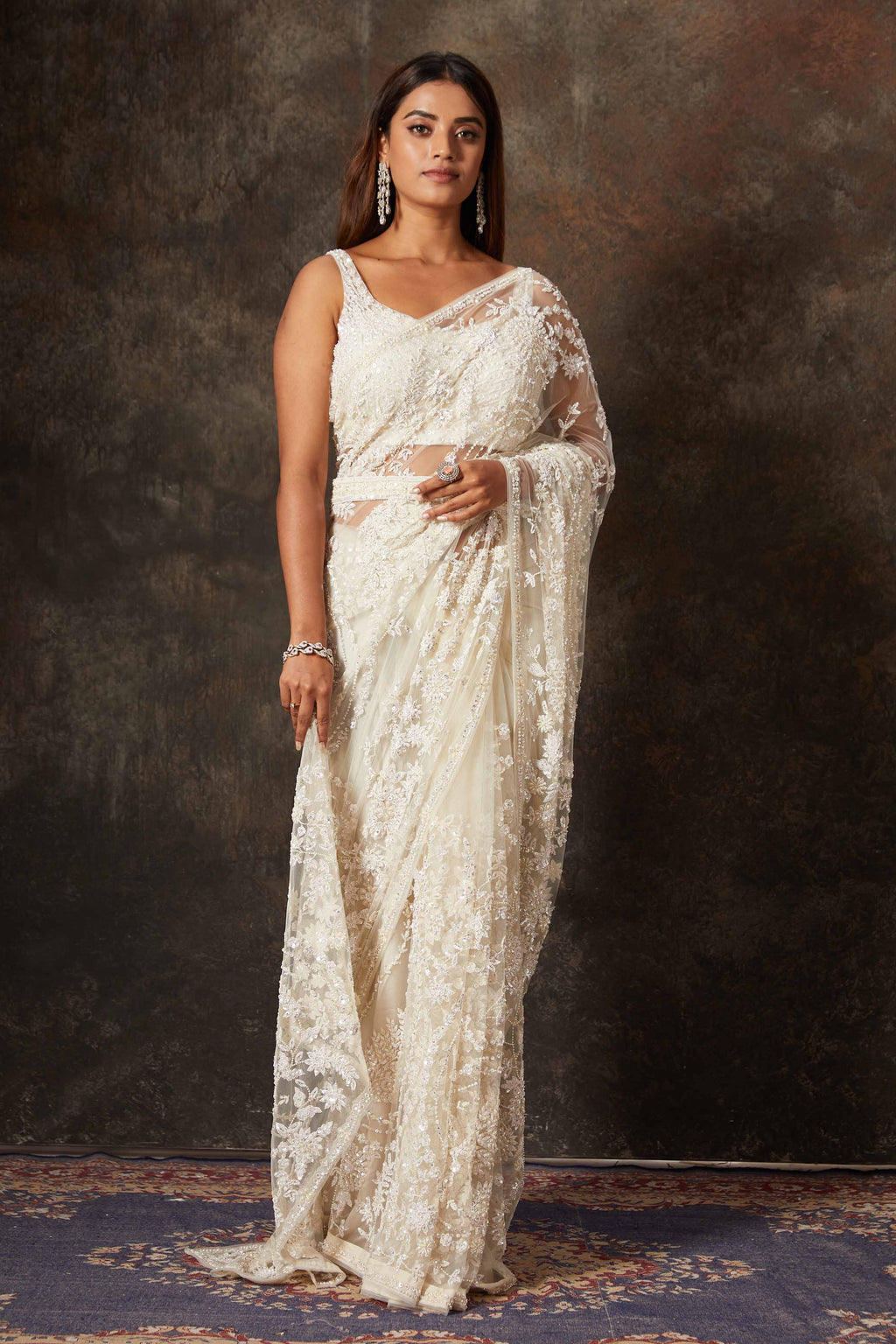 Shop beautiful cream net hand embroidery saree online in USA with blouse. Flaunt your Indian style on special occasions in beautiful designer sarees, embroidered sarees, Bollywood sarees, partywear sarees, wedding sarees from Pure Elegance Indian saree store in USA. -full view