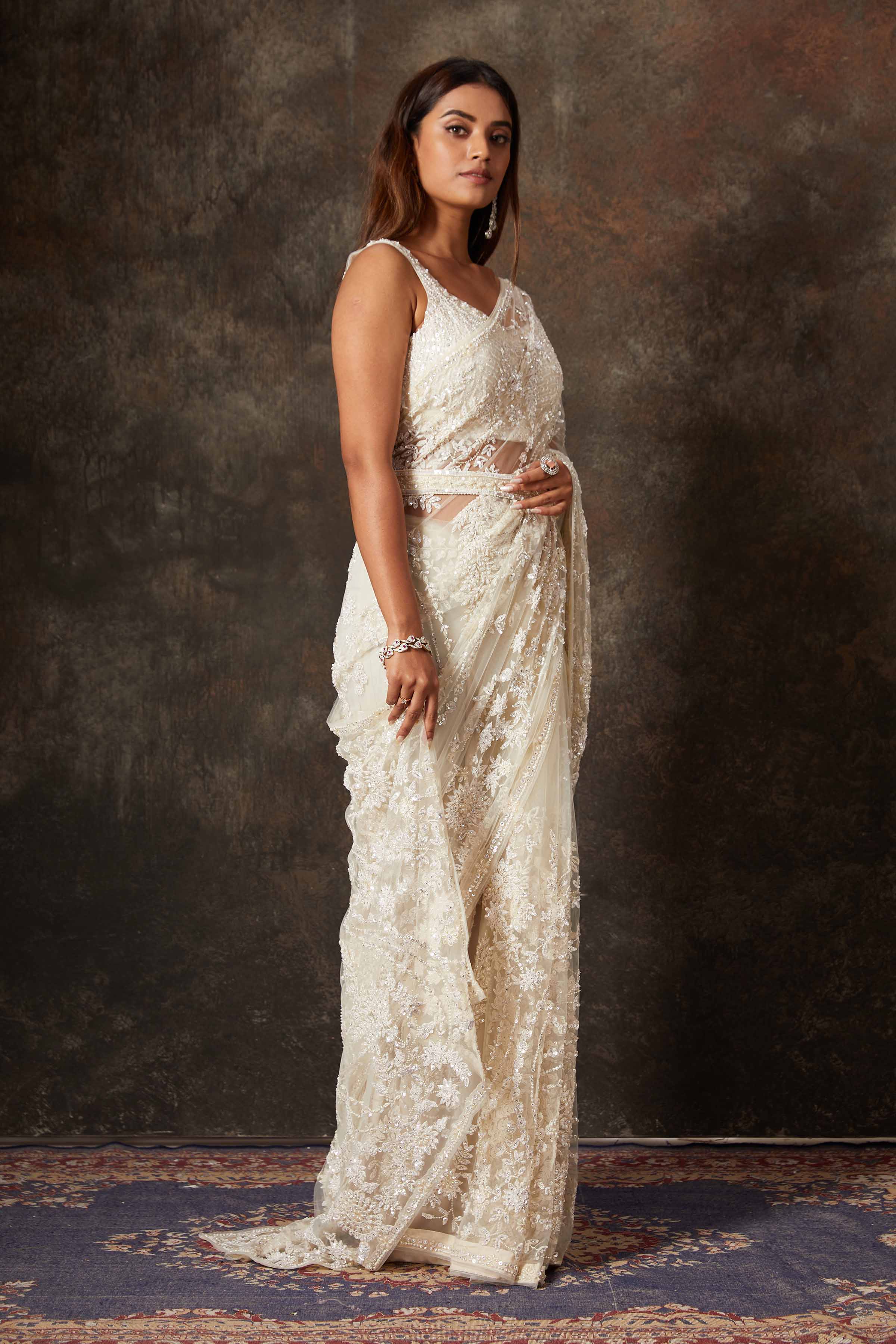 Shop beautiful cream net hand embroidery saree online in USA with blouse. Flaunt your Indian style on special occasions in beautiful designer sarees, embroidered sarees, Bollywood sarees, partywear sarees, wedding sarees from Pure Elegance Indian saree store in USA. -side