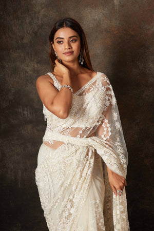 Shop beautiful cream net hand embroidery saree online in USA with blouse. Flaunt your Indian style on special occasions in beautiful designer sarees, embroidered sarees, Bollywood sarees, partywear sarees, wedding sarees from Pure Elegance Indian saree store in USA. -closeup