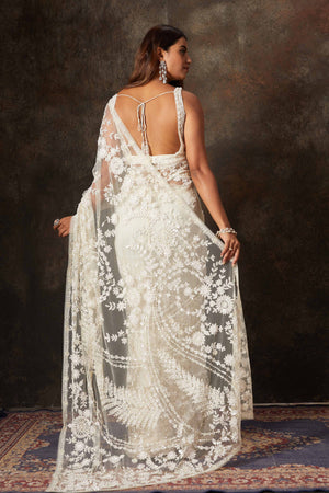 Shop beautiful cream net hand embroidery saree online in USA with blouse. Flaunt your Indian style on special occasions in beautiful designer sarees, embroidered sarees, Bollywood sarees, partywear sarees, wedding sarees from Pure Elegance Indian saree store in USA. -back
