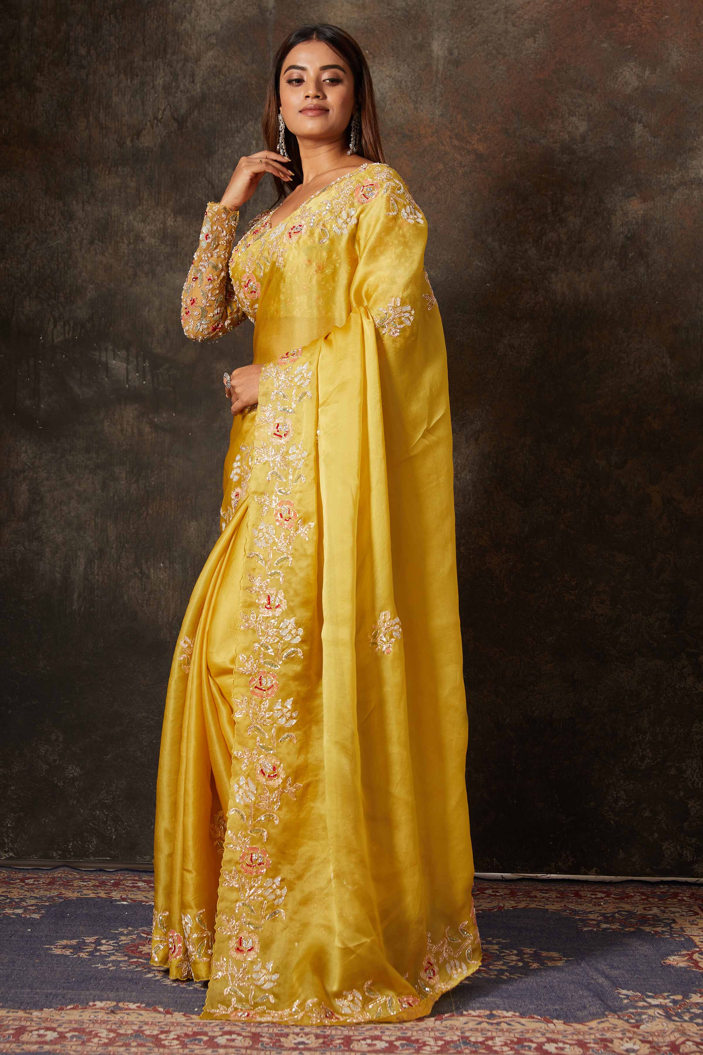 Buy beautiful mango yellow hand embroidered organza saree online in USA with blouse. Flaunt your Indian style on special occasions in beautiful designer sarees, embroidered sarees, Bollywood sarees, partywear sarees, wedding sarees from Pure Elegance Indian saree store in USA. -pallu