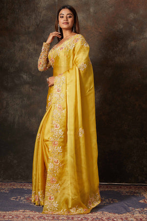 Buy beautiful mango yellow hand embroidered organza saree online in USA with blouse. Flaunt your Indian style on special occasions in beautiful designer sarees, embroidered sarees, Bollywood sarees, partywear sarees, wedding sarees from Pure Elegance Indian saree store in USA. -pallu