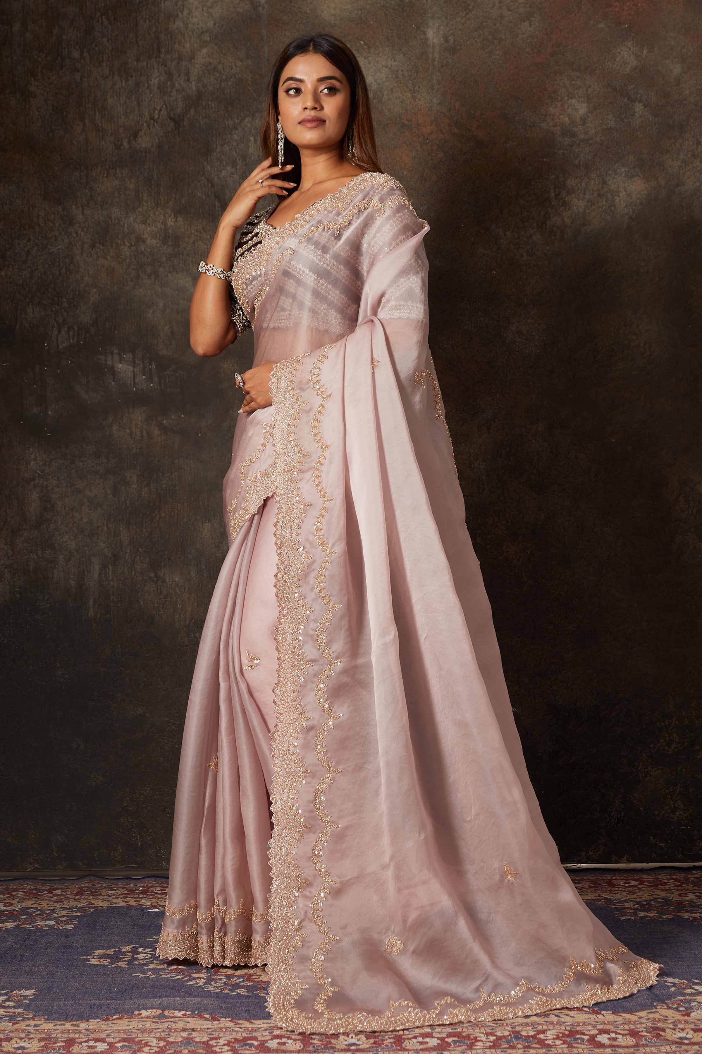 Buy beautiful lilac hand embroidered organza saree online in USA with heavy embroidery blouse. Flaunt your Indian style on special occasions in beautiful designer sarees, embroidered sarees, Bollywood sarees, partywear sarees, wedding sarees from Pure Elegance Indian saree store in USA. -side